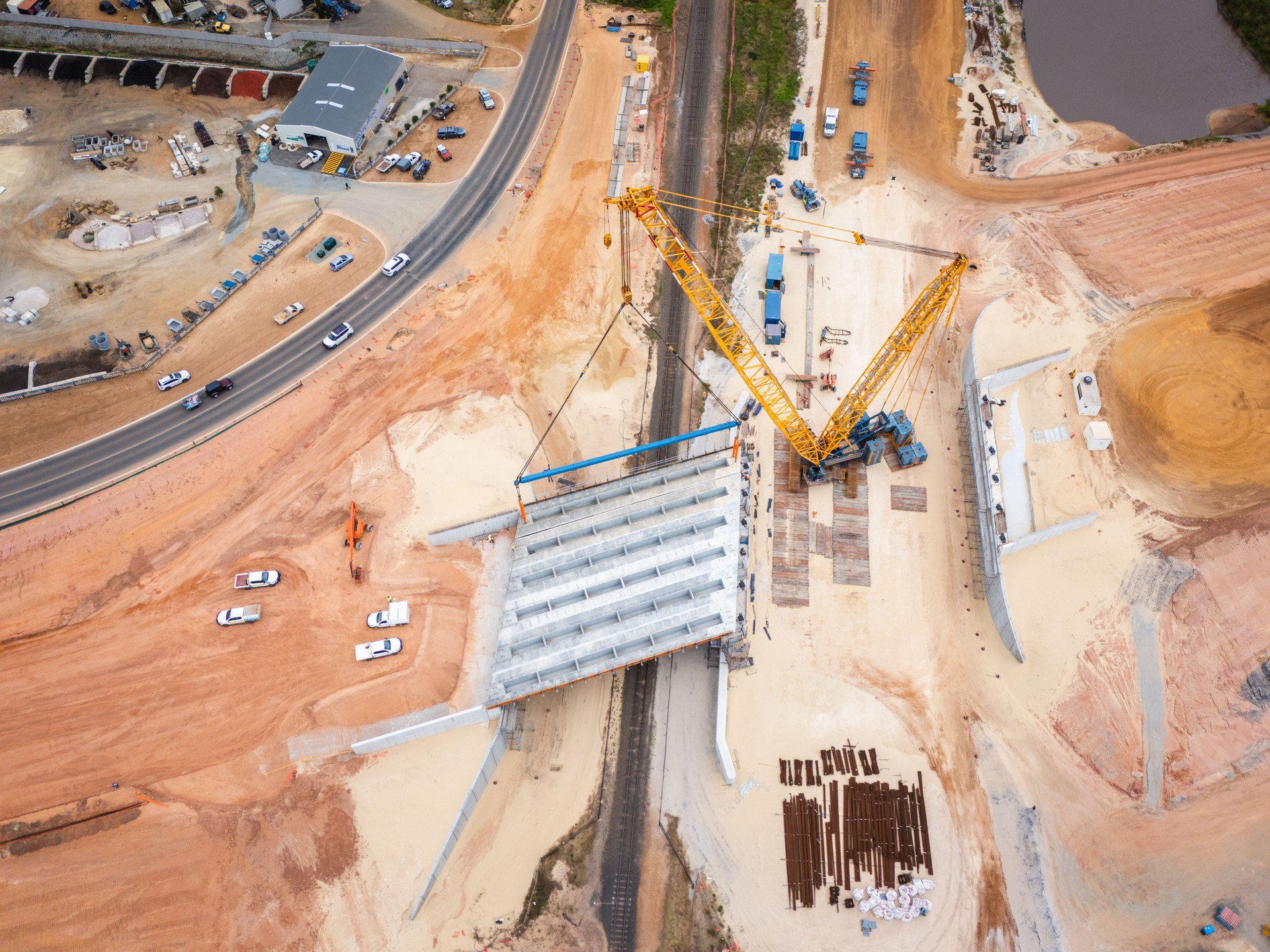 Aerial View of Bridge Construction With Crane and Infrastructure Development